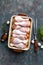 Raw uncooked chicken legs, drumsticks on wooden board, meat with ingredients for cooking