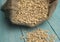 Raw uncooked grains on wood background