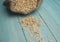 Raw uncooked grains on wood background