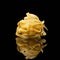 Raw uncooked tagliatelle nests on black background with reflection. Traditional Italian pasta