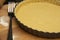 Raw, uncooked tart pie preparation, dough. Cooking apple, fruit pie. Cookign process. Kitchen table