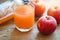 Raw and unfiltered organic apple cider vinegar in glass with apple fruit on the wooden table, apple cider vinegar natural remedies