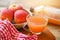 Raw and unfiltered organic apple cider vinegar in glass with apple fruit on the wooden table, apple cider vinegar natural remedies