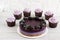 Raw vegan  cake with blackberries and blueberries.  Delicious cupcakes with lilac  cream with blackberries and rosemary.  Sugar,