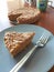Raw vegan chickpeas blondies cake on blue plate. Close up vegetarian dessert coconut carrot protein diet. Sugar free