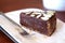 Raw vegan chocolate cake with ganache and almonds