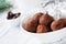 Raw vegan chocolate truffles with dates and raw chocolate