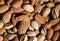 Raw vegan nuts background - almonds and pistachio