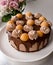 Raw vegan pear chocolate cake decorated with whipped coconut cream. Vegetarian cashew cream cheesecake gluten free