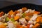 Raw vegetables cut into small pieces prepared for steaming, cauliflower, butternut, leek, carrot