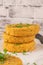 Raw veggie burger with chickpeas, vegetables and parsley leaves on kitchen countertop