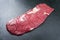 Raw wagyu bavette beef steak on rustic black board
