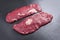Raw wagyu bavette beef steak on rustic black board