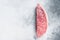 Raw wagyu rump sirloin steak, kobe beef meat. White background. Top view. Copy space