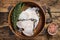 Raw wolffish or wolf fish fillet in a wooden plate. wooden background. Top view