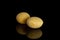 Raw yellow soya bean isolated on black glass