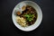 Rawon or Nasi Rawon/Rawon Rice is traditional Indonesian beef black soup served with sprouts, salted eggs, kluwek seasoning. From.