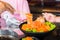 Raws salmon fillet with chopsticks on dish in restaurant