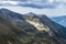 Ray of light on mountain ridges seen from Moldoveanu peak. Storm is coming