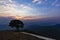 Ray of light penetrate through cloudy sky over mountain