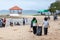 Rayong, Thailand 10 December 2020: Group of volunteers cleaning up beach line at Had Nam Rin