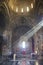 Rays of light thru window inside of church st. Poghos and Petros. in Tatev monastery complex, Armenia