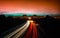 Rays of lights, in slow motion, of cars driving on the highway at night to enter and leave the city of Granollers, Barcelona