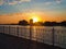 The rays of the setting sun on the embankment of the river Kuban