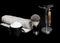 A Razor and brush on stand, towels, perfume, balsam and blades on a black background