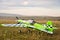 RC model green plane on runway