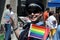 RCMP policewoman waves rainbow flag on Pride parade in Toronto, Canada in 2007