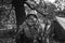 Re-enactor Dressed As World War Ii German Wehrmacht Sniper Soldier In Forest. Close Portrait In Camouflage. Photo In