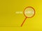 We`re hiring text with magnifying glass on yellow background