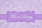 We`re Sorry message on a pale purple rose plush fabric with ribbon