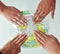 Reach out to the world. High angle shot of a group of unrecognisable people with their hands on a world globe.