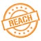 REACH text written on orange vintage stamp