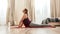 Reach your potential. Full-length shot of young curvy woman in sportswear practicing Cobra pose on a yoga mat at home