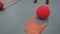 Reaching for a red dodgeball