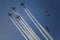Reactive jet plane flying in formation on blue sky