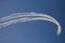 Reactive jet plane flying in formation on blue sky