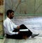 Reader in Iranian Mosque