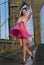 Readhead model dancing wearing pink chiffon dress