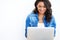 Reading a funny email. a young woman browsing the web on her laptop at home.