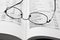 Reading glasses on open business book