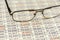 Reading glasses used to review spreadsheet report