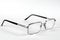 Reading glasses on a white background. Metal-rimmed glasses with