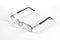 Reading glasses on a white background. Metal-rimmed glasses with