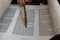 Reading the Torah scroll with a wooden pointer