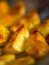 Ready baked potato slices with spices closeup