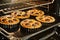 Ready-made cherry pie in large and small form after baking in an electric oven